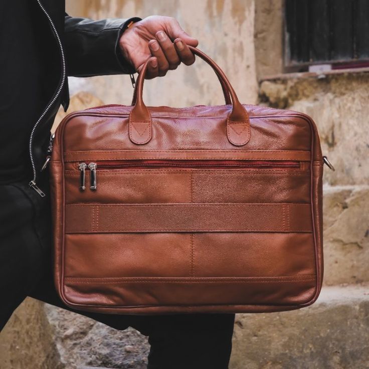 Made for men and women, our Executive Leather Laptop Bag is all about upgrading your work look .High Quality Bags with maximum functionality and minimal design to carry your laptop, files ,documents in a minimal possible way.Features ﻿ Crafted with 100% genuine Cow leather Laptop Compartment Size: Upto 15.5 inch Removable, adjustable padded shoulder strap Rear smart zipper allows you to attach this bag to the extended handles of rolling cases Main compartment has two large sections with one pock Professional Leather Shoulder Bag For Everyday Use, Classic Leather Backpack With Laptop Sleeve For Daily Use, Professional Leather Satchel For Everyday Use, Everyday Leather Rectangular Laptop Bag, Leather Shoulder Bag With Laptop Sleeve For Work, Everyday Leather Briefcase Rectangular, Leather Satchel With Laptop Sleeve For Work, Rectangular Leather Briefcase For Everyday, Leather Briefcase For Everyday Use