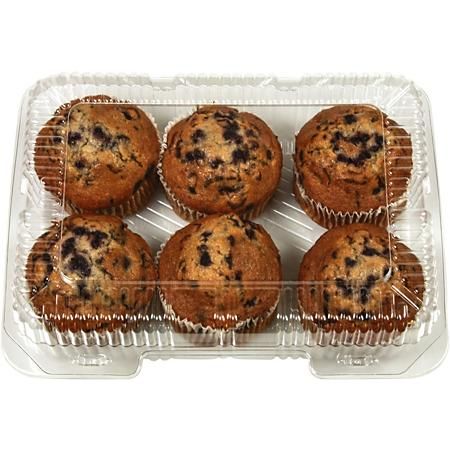 blueberry muffins in a plastic container on a white background