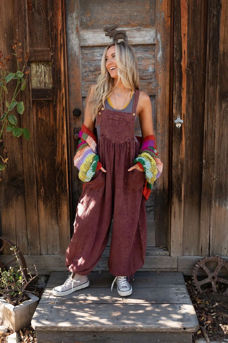 Get ready to look effortlessly boho - chic and ready - to - go in the Coastal Muse Wide Leg Jumpsuit! Feel authentically you in this cute jumpsuit because it features: Comfortable, lightweight, mineral - washed Cotton gauze fabric Loose and slouchy jumpsuit overall silhouette Classic square neckline with adjustable button straps Flattering gathered pointed center seams Oversized wide pant legs with unique tied gathered details along the ankles Convenient side pockets, a single cargo pocket along Bohemian Relaxed Fit Jumpsuits And Rompers For Loungewear, Bohemian Jumpsuits And Rompers With Pockets For Spring, Bohemian Overalls With Pockets For Spring, Bohemian Relaxed Fit Overall Jumpsuit, Relaxed Fit Brown Jumpsuits And Rompers For Fall, Bohemian Cotton Overalls For Spring, Bohemian Jumpsuits And Rompers With Pockets For Beach, Bohemian Summer Overalls With Pockets, Bohemian Sleeveless Overalls With Pockets