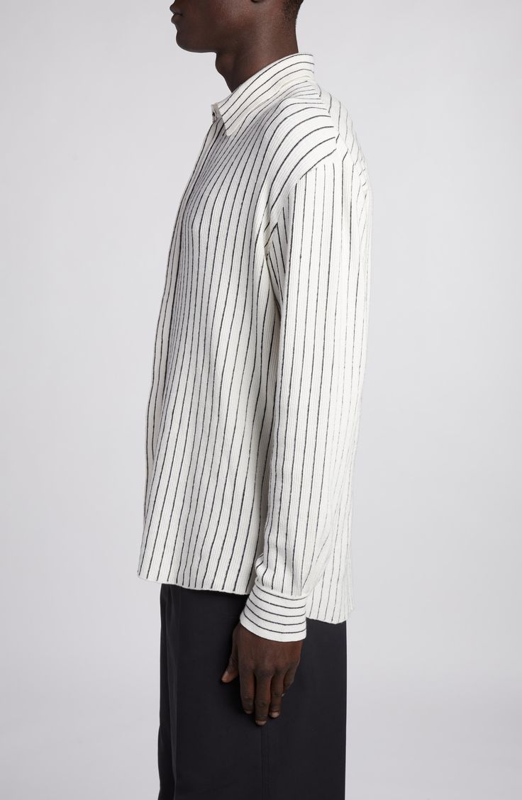 The Italian fashion house offers a relaxed take on a classic button-up with this pinstriped sweater-knit shirt featured in the label's spring '24 runway show. 28 1/2" length; 43" chest (size Medium) Hidden-button placket Spread collar Long sleeves with button cuffs 50% cotton, 50% linen Dry clean Made in Italy Designer Clothing Classic Long Sleeve Sweater With Contrast Stripes, Classic Striped Cotton Sweater, Classic Striped Crew Neck Shirt, Classic Long Sleeve Pinstripe Tops, Classic Striped Tops With Ribbed Cuffs, Pinstripe Long Sleeve Top With Striped Cuffs, Classic Long Sleeve Tops With Vertical Stripes, Classic Striped Sweater For Work, Classic Striped Sweater For Spring