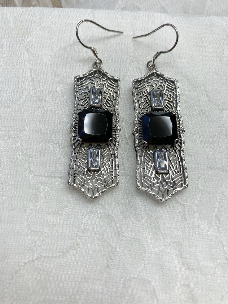 "Black Cubic Zirconia Earrings Square Peg Design#E63 Custom Made About 12 months ago I found a lovely Art Deco brooch and fell in love with the design. Fashioned in the design of the brooch, I now offer these lovely Antique reproduction earrings in sterling silver (matching pendant also available for sale in my store). The 3ct simulated black cubic zirconia gemstone is 10mm in L & W (3/8th\"). The 2 baguette CZ gems are 6mm x 3mm. The pendant is 1 3/4 inches long, it is just shy of 5/8th\" a Elegant Stamped 925 Earrings For Formal Occasions, Elegant 925 Stamped Earrings For Formal Occasions, Elegant Formal Earrings Stamped 925, Sterling Silver Filigree Jewelry For Party, Evening Jewelry In Sterling Silver With Intricate Design, Elegant Black Filigree Earrings, Black Art Deco Earrings For Evening, Pierced Sterling Silver Jewelry For Evening, Formal Silver Pierced Crystal Earrings