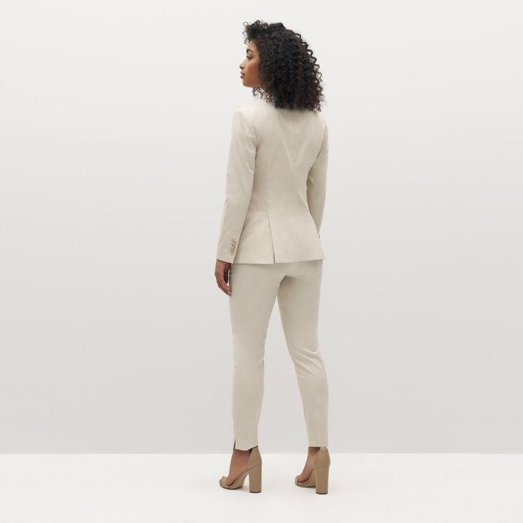 Keep it cool in the women’s tan suit. Meticulously tailored with comfortable drape, our luxurious light beige suit plays up a classic look. Perennially on-trend, this delicate camel pantsuit is constructed with Eco Stretch fabric for a breezy feel and a look that moves with you. Chic Structured Suits For Work, Beige Business Casual Suits, Beige Notch Lapel Pantsuit For Work, Chic Structured Business Casual Suits, Elegant Fitted Beige Pantsuit, Elegant Tailored Beige Tweed Jacket, Elegant Beige Tweed Jacket With Suit Collar, Fall Beige Business Casual Pantsuit, Chic Beige Suit For Office