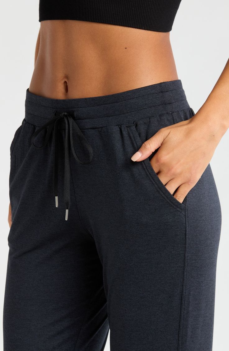 Made from a soft, stretchy recycled blend, these lightweight joggers are the perfect way to kick back in comfort during warmer months. 26" inseam; 9" leg opening; 10 1/2" front rise; 14" back rise (size Medium) 88% recycled polyester, 12% spandex Machine wash, tumble dry Imported Comfy Black Activewear For Loungewear, Comfy Black Bottoms With Comfort Waistband, Solid Activewear With Elastic Waistband In Recycled Polyester, Comfort Stretch Athleisure Joggers With Comfort Waistband, Athleisure Joggers With Comfort Stretch, Athleisure Comfort Stretch Joggers With Waistband, Comfortable 4-way Stretch Activewear Pants, Comfy Solid Activewear With Elastic Waistband, Athleisure Joggers With Functional Drawstring For Workout