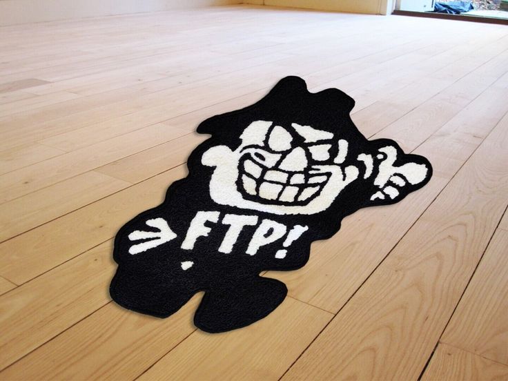 a black and white rug with an image of a cartoon character on it