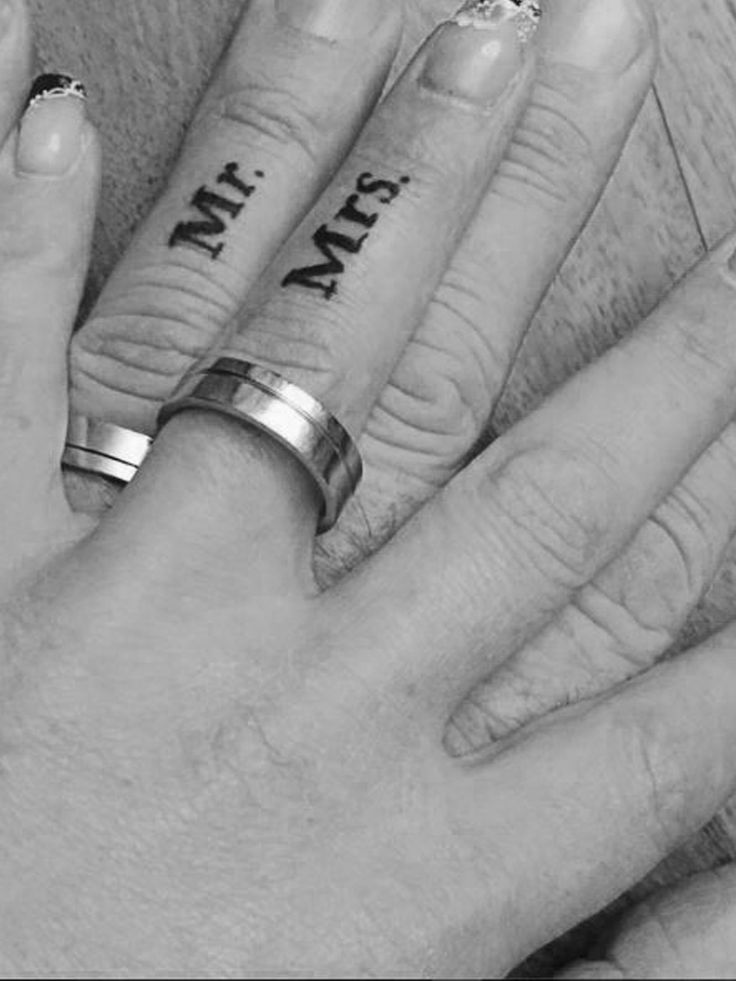 two people's hands with rings on their fingers and the words mitt written on them