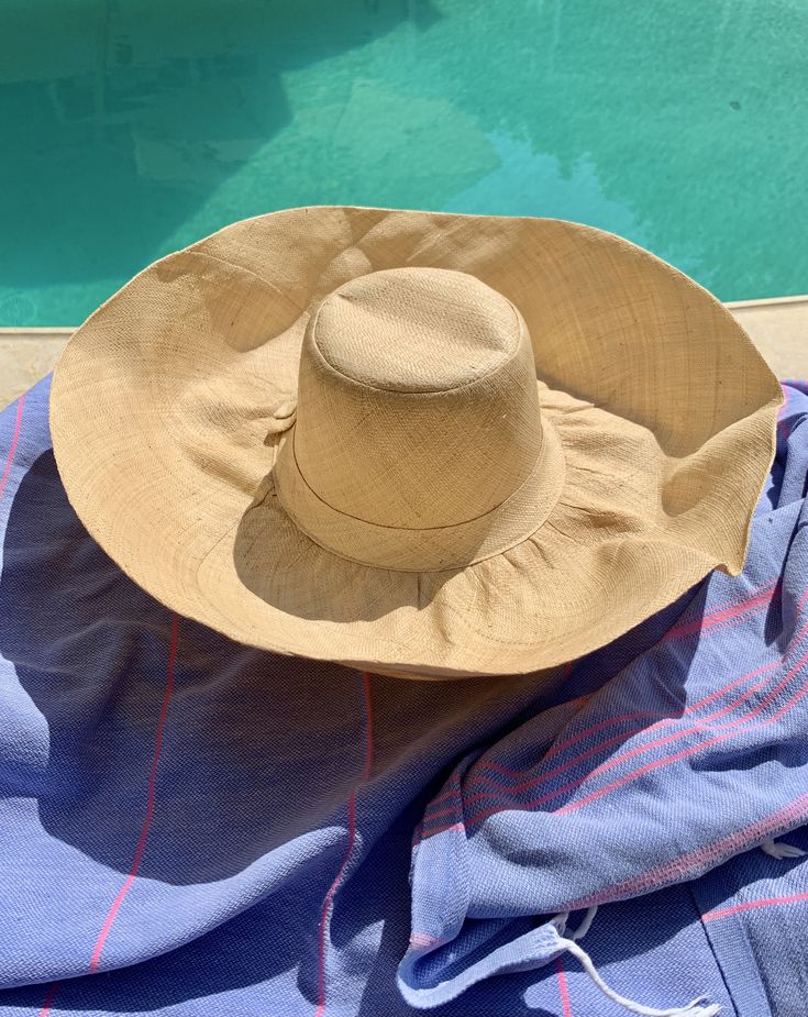 "Natural beige palm straw hat called the 'Poppadom!' A flexible wide brim hat you can switch into any shape - so it's lots of fun and can be styled for any occasion. Easy to wear, not hot and easy shape to your liking. Soft, natural material made from palm straw. Returns back to it's original shape. This hat is handmade, easy to wear, great for travel and a best seller! 🌀Flat top crown 🌀Flexible brim to adjust to your style 🌀Casual sun protection hat great for walking or gardening 🌀Lightweig Luxury Casual Sun Hat With Flat Crown, Luxury Sun Hat With Upf 50+ And Flat Brim, Luxury Fitted Sun Hat For Vacation, Cheap Khaki Beach Hats, Luxury Flat Crown Sun Hat For Vacation, Luxury Vacation Straw Hat With Flat Crown, Luxury Upf 50+ Sun Hat For Summer, Cheap Yellow Sun Hat For The Beach, Cheap Yellow Sun Hat For Spring