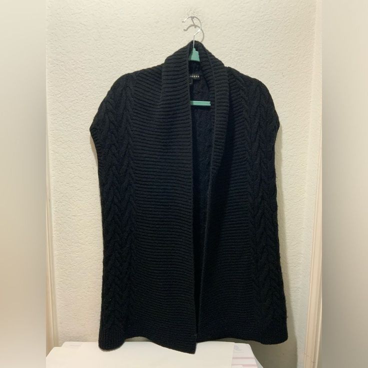 Very Good Condition Black Knit Vest For Workwear, Black Knit Vest For Work, Black Cable Knit Cardigan For Layering, Sleeveless Black Sweater For Work, Black Cable Knit Outerwear For Layering, Knit Vest Outerwear For Layering, Black Vest Sweater For Fall, Fitted Black Sweater Vest, Black Vest For Fall Layering