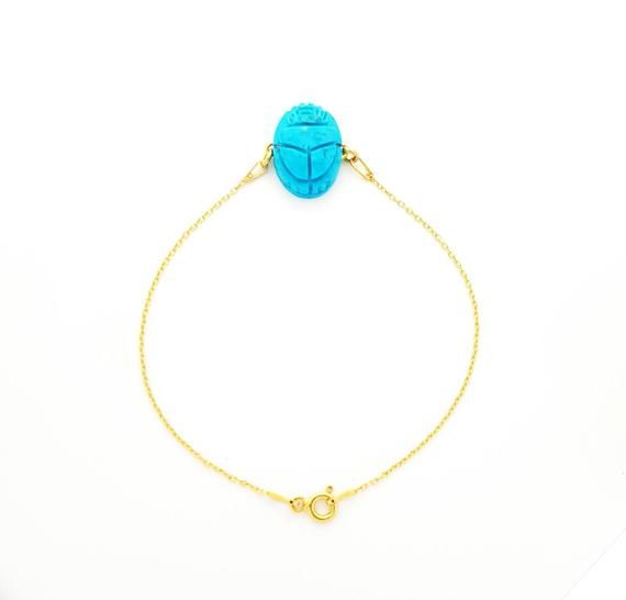 ***** CHRISTMAS OFFER *****FREE EXPRESS SHIPPING ON ORDERS OF 99$ OR MORE TO ALL US CUSTOMERS.Nothing you need to do, simply we will automatically upgrade your order to Express shipping when you buy for 99$ or more.Turquoise Scarab Bracelet, 14k Gold Scarab Charm Bracelet, Egyptian Beetle Bracelet, Ancient Egyptian Jewelry.Scarab amulets were used by ancient Egyptians for their magical rejuvenating properties, they were to give powers of protection or renewal for the wearer. Scarabs found often Adjustable Turquoise 14k Gold Jewelry, Adjustable 14k Gold Turquoise Jewelry, Turquoise Birthstone Bracelet, Adjustable Turquoise Birthstone Jewelry, Turquoise Bracelet Jewelry Gift, Turquoise Cabochon Round Bracelets, Turquoise Round Cabochon Bracelets, Turquoise Cabochon Bracelet, Engraved Turquoise Bracelet Jewelry