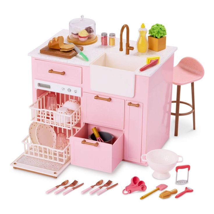 a doll house kitchen with pink furniture and accessories on the counter, including utensils