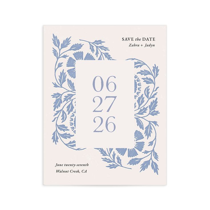 save the date card with blue flowers and leaves on it, printed in white paper