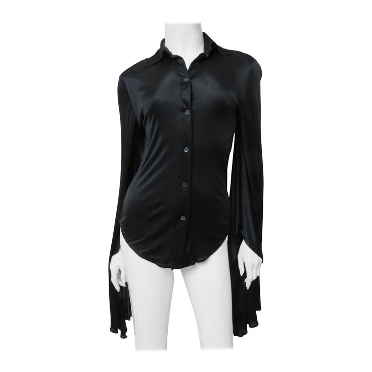 A fabulous black fine stretch silk shirt, top, blouse from Tom Ford for Gucci. It is semi fitted with a shirt collar, black mother of pearl Gucci inscribed button up the front and great long draping angel sleeves. Fit sizes Extra Small, Small. Marked Italian size 38. Bust 35" Sleeves 36" Length 26" Gucci Formal Button-up Shirt, Luxury Gucci Blouse For Office, Black Gucci Winter Top, Elegant Gucci Blouse For Evening, Gucci Black Tops For Spring, Elegant Gucci Blouse For Party, Elegant Gucci Party Blouse, Chic Gucci Collared Blouse, Gucci Black Top For Night Out