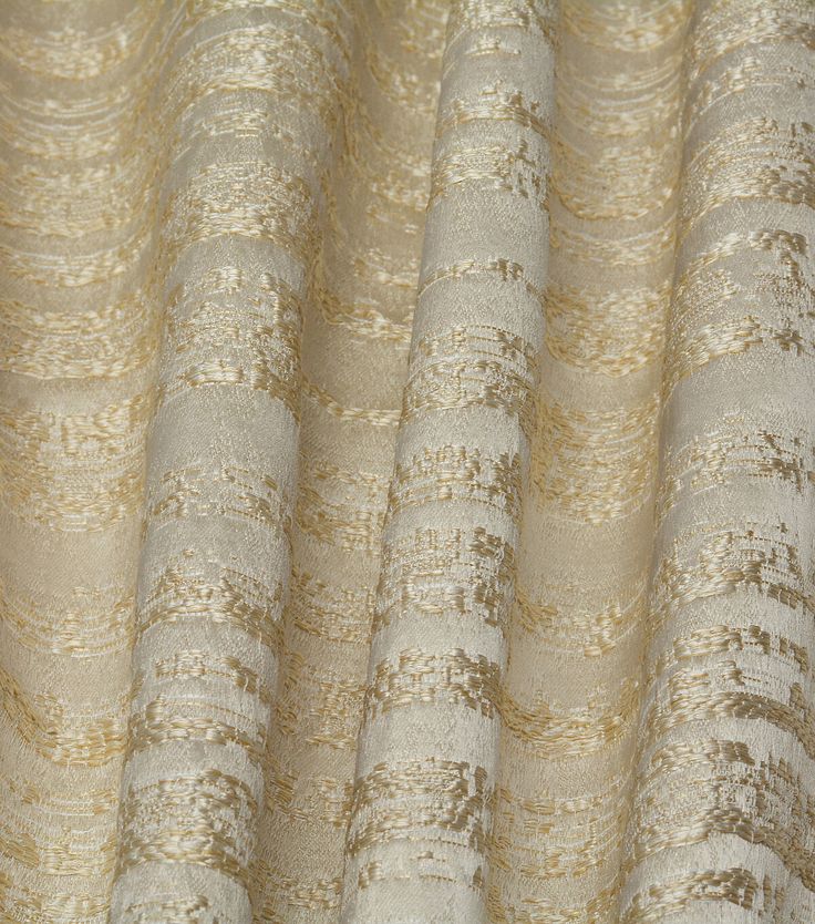 an image of a curtain with gold and white stripes on it's fabric material