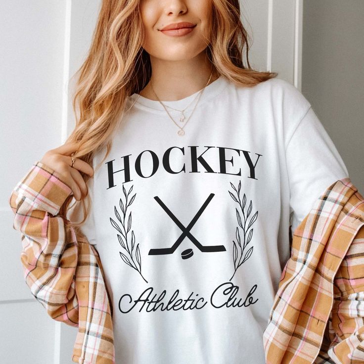 Gear up your inventory with our Hockey Athletic Club Comfort Color Tee, a must-have for fans of the game looking to showcase their passion in style. Crafted with premium materials and featuring a dynamic design, this tee is the perfect addition to any sports enthusiast's wardrobe. For those who bleed hockey, this tee is a statement piece, boasting bold graphics and vibrant colors that capture the essence of the game. Whether you're cheering from the stands or hitting the ice yourself, this tee i Athletic Club, Athletic Clubs, Dynamic Design, Comfort Colors Tee, Bold Graphics, Comfort Color, The Ice, Custom Clothes, Chambray