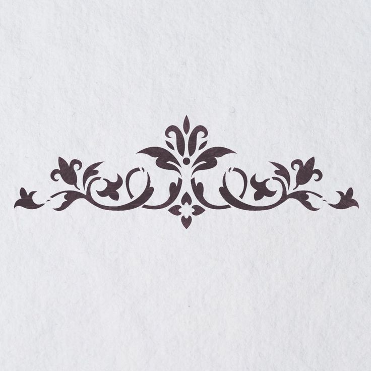 an ornate design on white paper with black ink