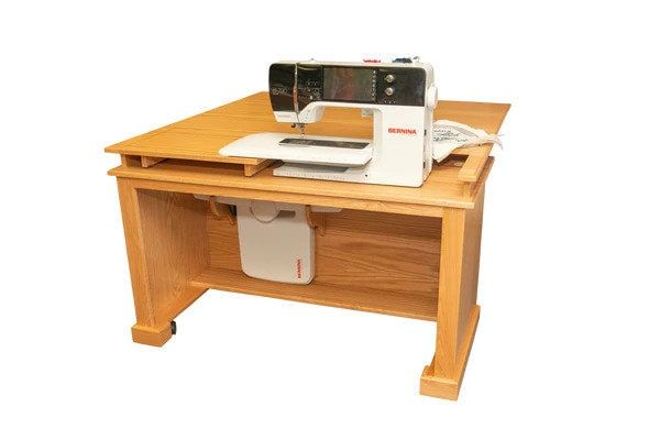 a sewing machine sitting on top of a wooden desk