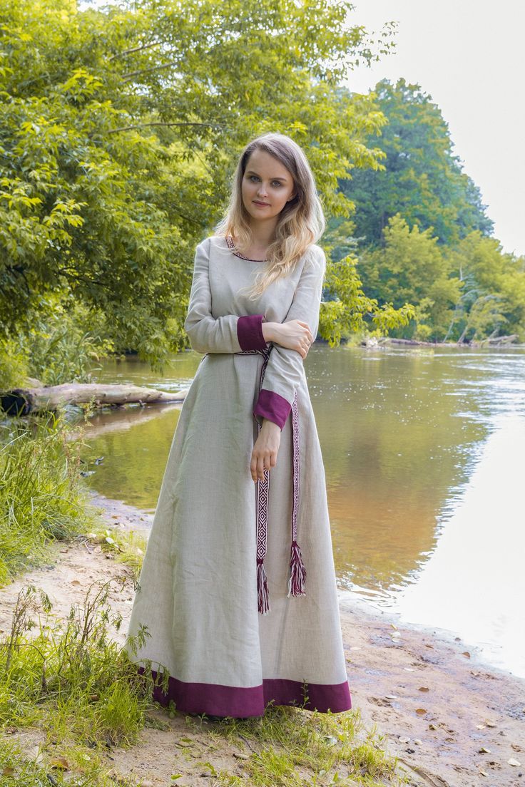 "100% Linen dress in a historical style. Early medieval linen dress, universal for the Vikings and Slavs or any others reenactors. Based on medieval iconography and archaeological finds from Europe. Simple minimalistic dress for every day or any other event. Two wedges and modern cut of the sleeves help the dress to fit your figure well, move freely and look great at the same time! ----------------------------------------------------------- FABRIC The materials are resistant to washing and the q Peasant Style Medieval Linen Dress For Larp, Peasant Style Linen Medieval Dress For Larp, Medieval Style Linen Dress For Larp, Medieval Linen Dress For Larp And Medieval Festivals, Medieval Linen Dress For Larp And Festivals, Cotton Dresses For Larp, Fitted Linen Medieval Dress, Peasant Style Long Sleeve Linen Medieval Dress, Woman Viking