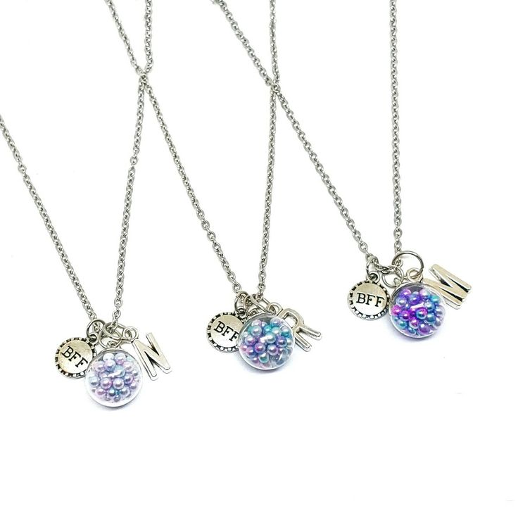 These adorable coordinating necklaces are the perfect gift for your little one and her best friends. Each necklace features a pearl filled bauble, a letter charm and a bff charm on a 18 inch cable chain necklace with lobster claw clasp. Each necklace will arrive individually packaged in an organza bag making them ready to give as gifts. Select the amount of necklaces from the drop down menu then enter the letter and pearl color you would like in the personalization box. Single pearl colors: Red, Ballerina Jewelry, Glitter Colors, Single Pearl, Birthday Bracelet, Cardboard Jewelry Boxes, Best Friend Necklaces, Cable Chain Necklace, Pink Purple Blue, Friendship Necklaces