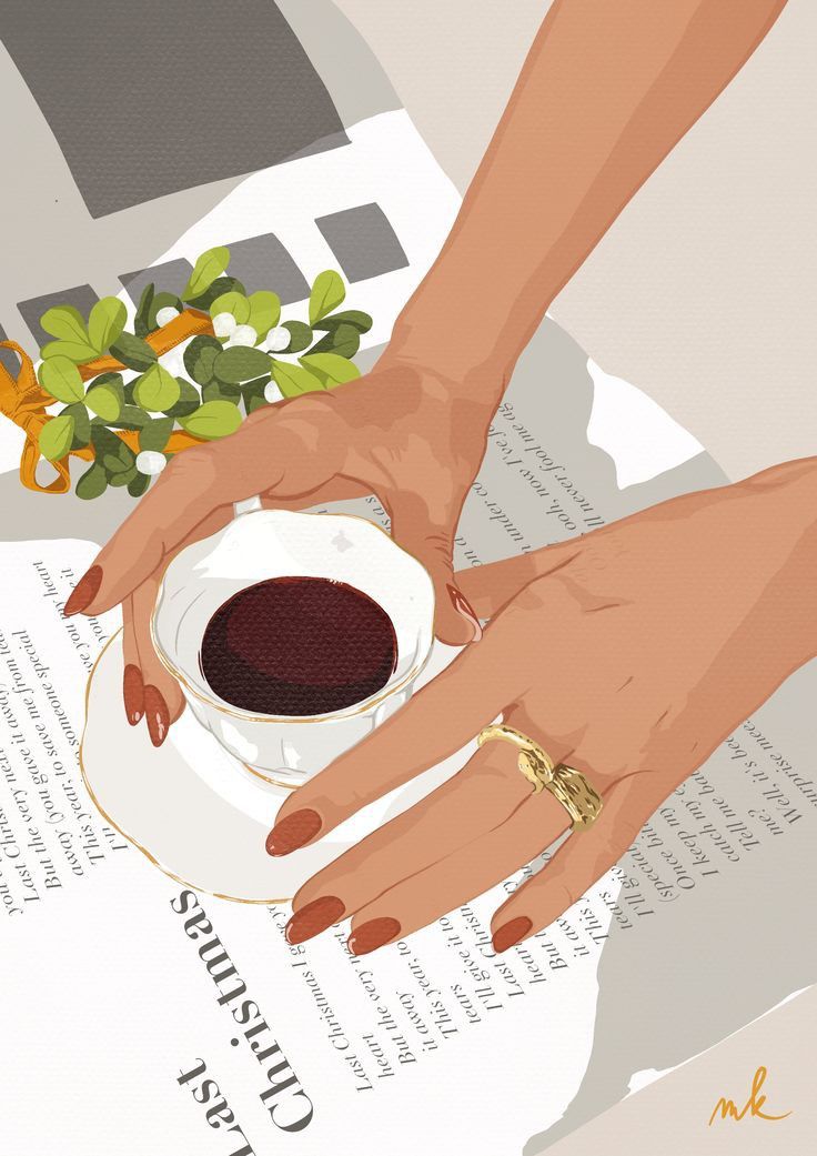 two hands holding a coffee cup and saucer on top of a book with flowers