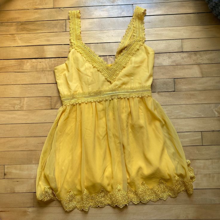 Never Worn And Nwt Yellow Nbd V Neck Dress With Beautiful Detailed Lacing! Yellow V-neck Sundress For Party, Yellow Lace Trim Dress For Vacation, Mustard V-neck Mini Dress For Day Out, Yellow V-neck Sundress, Yellow V-neck Mini Dress For Brunch, Yellow V-neck Daytime Dress, V Neck Dress, Gold Yellow, Neck Dress