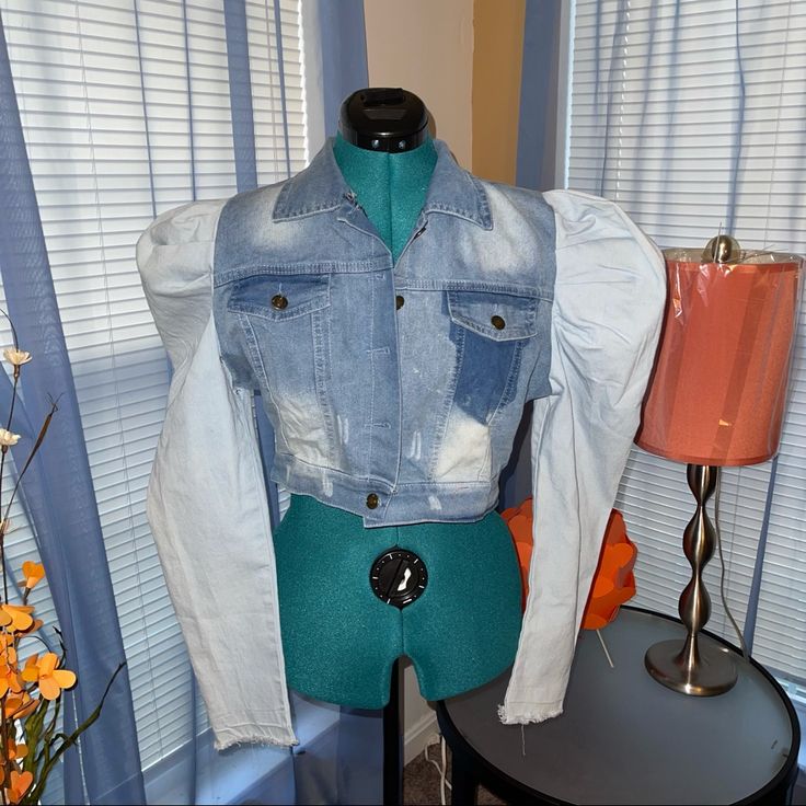 Women’s Puffy Sleeves Cropped Denim Jacket Light Weight. Front Button Closure. Front Top Pockets. Distressed Cuffs. Stone Washed Mixed Blue Denim. Plenty Of Stretch. Nwot Material: Cotton/Polyester Size: Medium Sleeves: 26’ Full Length: 16’ Bust: 34/36 Waist: 32’ Measurements Are Approximates. Puffy Long Sleeve Outerwear For Streetwear, Trendy Fitted Light Wash Outerwear, Trendy Light Wash Fitted Outerwear, Fitted Medium Wash Outerwear With Patchwork, Trendy Denim Blue Puff Sleeve Tops, Long Sleeve Puffer Outerwear In Recycled Polyester, Puffed Sleeve Denim Jacket, Recycled Polyester Long Sleeve Puffer Outerwear, Fitted Medium Wash Patchwork Outerwear