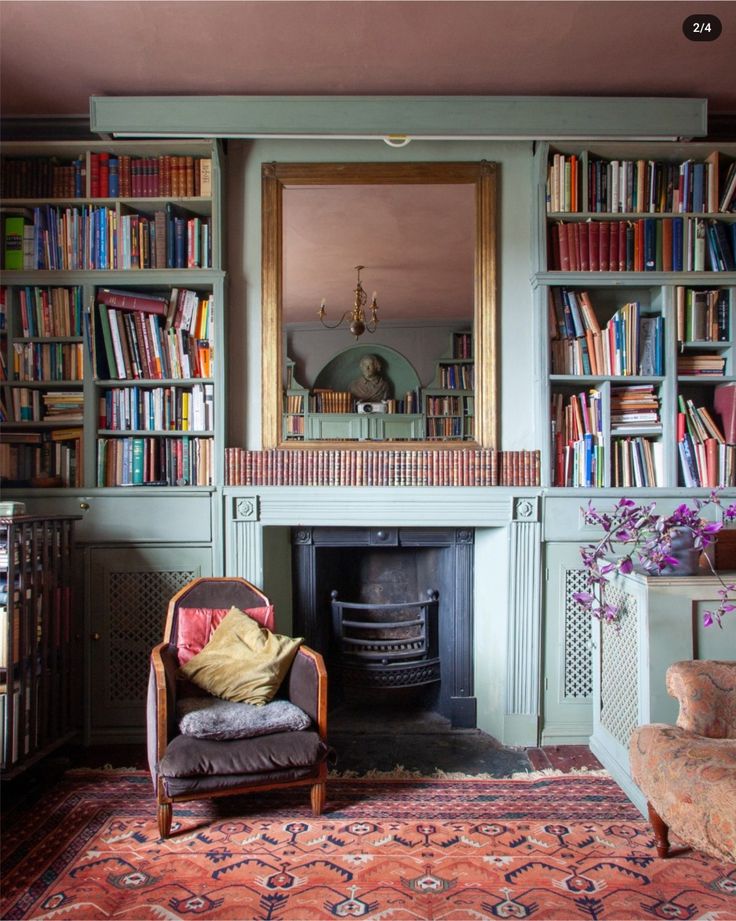 a living room filled with lots of furniture and bookshelves next to a fire place