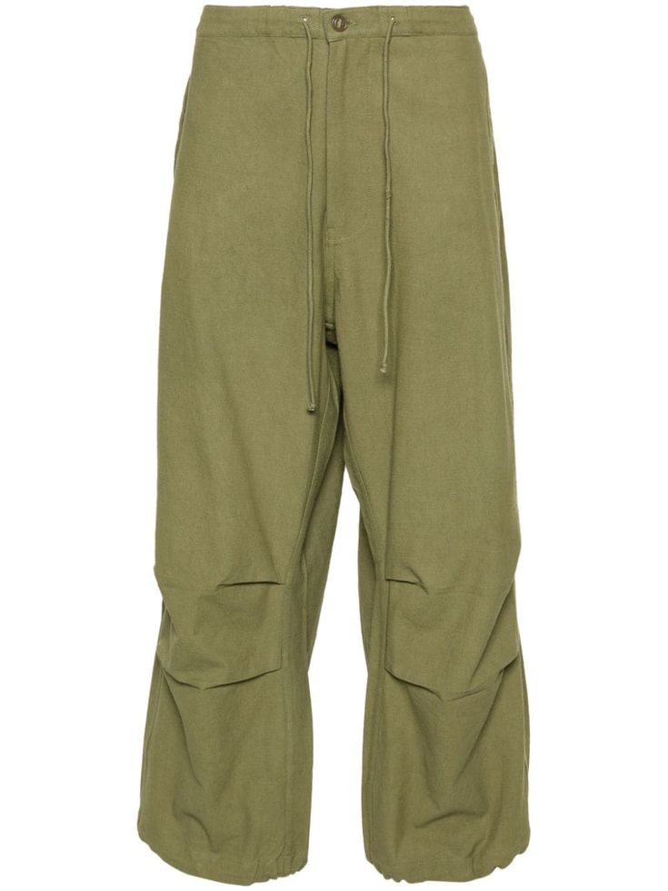 olive green organic cotton canvas naturally dyed elasticated waistband two side flap pockets rear flap pocket pleat detailing embroidered logo to the knee drawstring ankles drawstring fastening When buying this unisex item, keep in mind that it is graded in standard men's sizing. Story Mfg, Men's Journal, Planet People, Organic Materials, Loose Pants, Naturally Dyed, Drawstring Pants, Mens Trousers, Flap Pocket