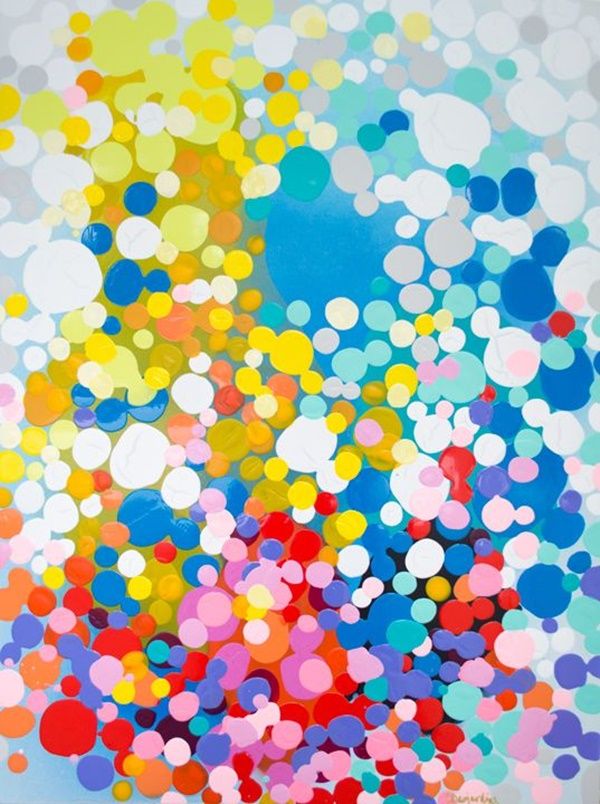 an abstract painting with lots of different colored dots on the ground and in the air