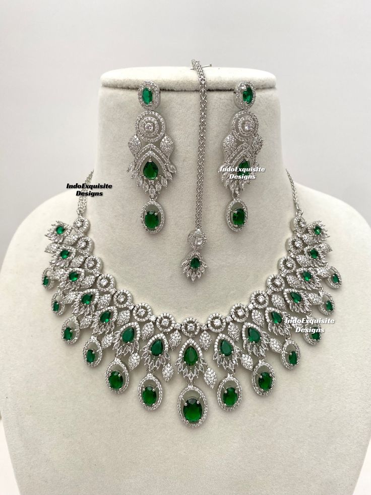 American Diamond Necklace Set/CZ Necklace/ Reception Jewelry/Statement Necklace Set/silver green     All items are shipped from Brampton, Ontario, Canada. If you need your item by a certain day, please reach out to us for express delivery option before placing the order so that we can update the shipping for you. Standard shipping/delivery timeline Below are the delivery timeline estimates once the order is shipped. ---> USA delivery timeline * 3-6 business days to major urban centers in USA. It Silver Necklace With Sparkling Stones For Reception, Dazzling Green Emerald Necklace, Silver Emerald Jeweled Necklace For Anniversary, Dazzling Silver Bridal Necklace With Stone Setting, Dazzling Green Emerald Necklace For Anniversary, Formal Green Stone Necklaces, Dazzling Green Emerald Necklace For Formal Occasions, Formal Green Stone Necklace, Green Round Crystal Jewelry