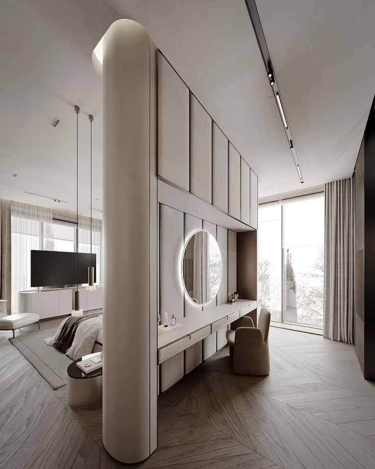 a modern bedroom with white walls and wooden floors, large mirror on the wall above the bed