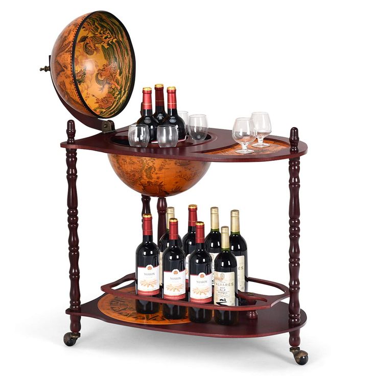 there is a wine rack with bottles and glasses on the top, next to a globe