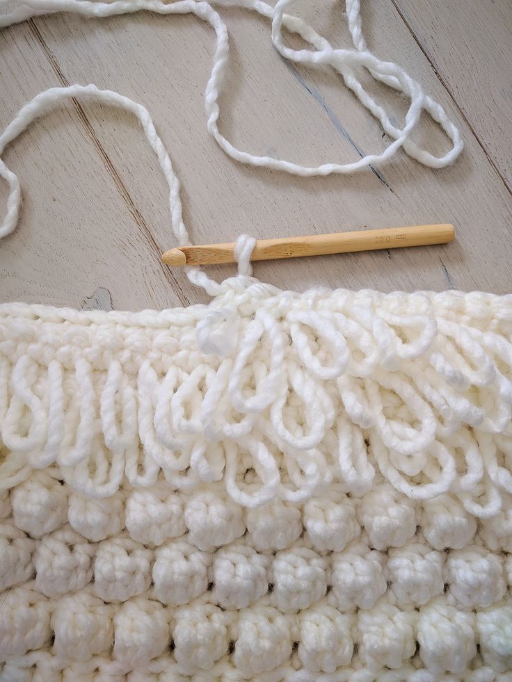 the crochet is being worked on with yarn