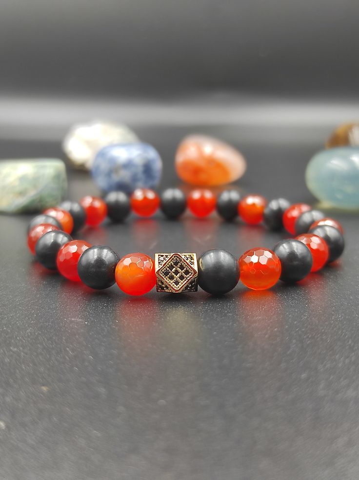 We designed by using the unique natural Shungite stone, Hematite stone and Carnelian stone together. Shungite stones and Carnelian in the handmade bracelet are 8 mm. We guarantee that all our gemstones are of the highest quality and 100% genuine. You can find our other jewelry made with Shungite stone in our store. Our store also has handmade eyeglass chains, necklaces, bracelets.  You can visit our store for all handmade jewelry.   Instagram Profile : @lightcropjewelry Black Carnelian Jewelry For Gifts, Hematite Beaded Bracelets With Natural Stones As Gift, Handmade Black Carnelian Jewelry, Black Agate Beaded Bracelet Gift, Handmade Black Agate Bracelets, Spiritual Onyx Beaded Bracelets Gift, Spiritual Onyx Bracelets As Gift, Spiritual Onyx Bracelets For Gift, Black Agate Bracelets As Gift