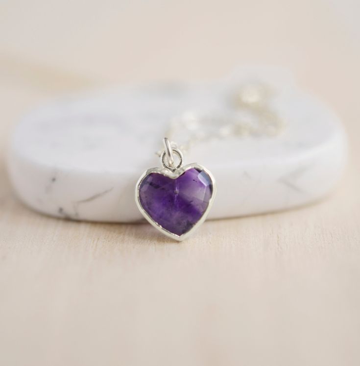 Give yourself some love or show your love for that special someone in your life with this heart necklace!Amethyst is believed to carry the energies of passion, creativity, and spirituality. It's also said to assist with temperance and sobriety, as well as inflammation.This necklace is handcrafted with a purple Amethyst faceted heart pendant. Each stone is natural and therefore contains natural inclusions or crystal formations. They are edged in 24k gold or silver electroplate. STONE SIZE: averag Amethyst Heart, Necklace Amethyst, Crystal Formations, Amethyst Pendant, Amethyst Stone, Gold Filled Chain, Amethyst Crystal, 14kt Gold, Purple Amethyst