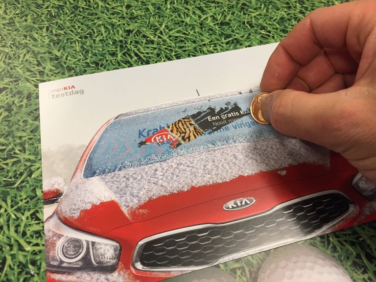 a hand is holding a toy car with snow on the hood and it's front end