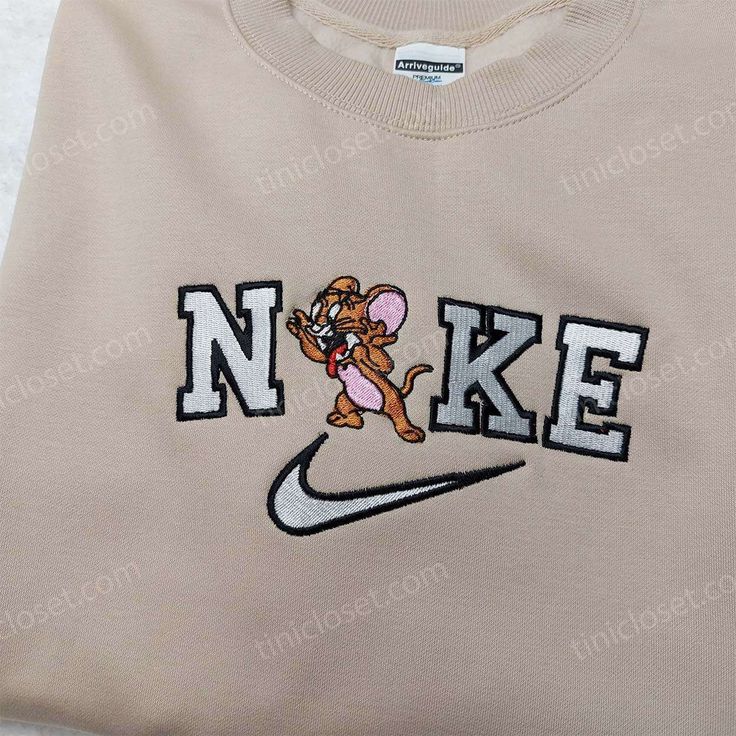 Nike Jerry Embroidered Sweatshirt, Custom Nike Embroidered Shirt, Cute Embroidered Sweatshirts Tinicloset is an online store that specializes in selling high-quality embroidered sweatshirts, t-shirts, and hoodies. The store offers a wide range of products, including the popular Nike Jerry embroidered sweatshirt, custom Nike embroidered shirt, and cute embroidered sweatshirts that are designed to meet the... Iron On Patch Ideas Clothes, Crewneck Embroidery, Vintage Nike Sweatshirt, Nike Crewneck, Diy Sweatshirt, Custom Nike, Cute Shirt Designs, Nike Sweatshirt, Nike Sweater