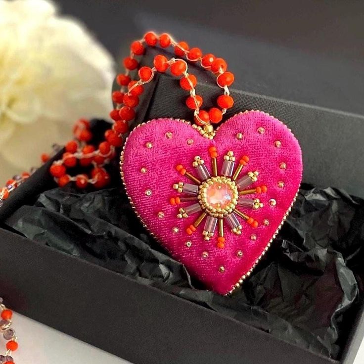 This bright pink heart pendant necklace will  definitely add a charm to any outfit or can be a perfect gift for any occasion.  Long orange glass beads necklace is crocheted by hand  with orange glass beads and embellished with hot pink velvet heart pendant. The pendant is embroidered with glass beads and the sparkle crystal in the center. This unique handmade piece of jewelry could be a perfect gift for whose who loves handcrafted artsy jewelry.  💝Jewelry comes in a lovely box and is ready for Bohemian Pink Necklaces With Heart Beads, Pink Bohemian Necklace With Heart Beads, Bohemian Pink Necklace With Heart Beads, Bohemian Pink Heart Beads Necklace, Valentine's Day Beaded Party Necklace, Pink Beaded Chain Jewelry For Valentine's Day, Handmade Pink Necklace As Gift, Pink Heart Beads Pendant Necklace, Pink Necklaces With Colorful Beads For Gift