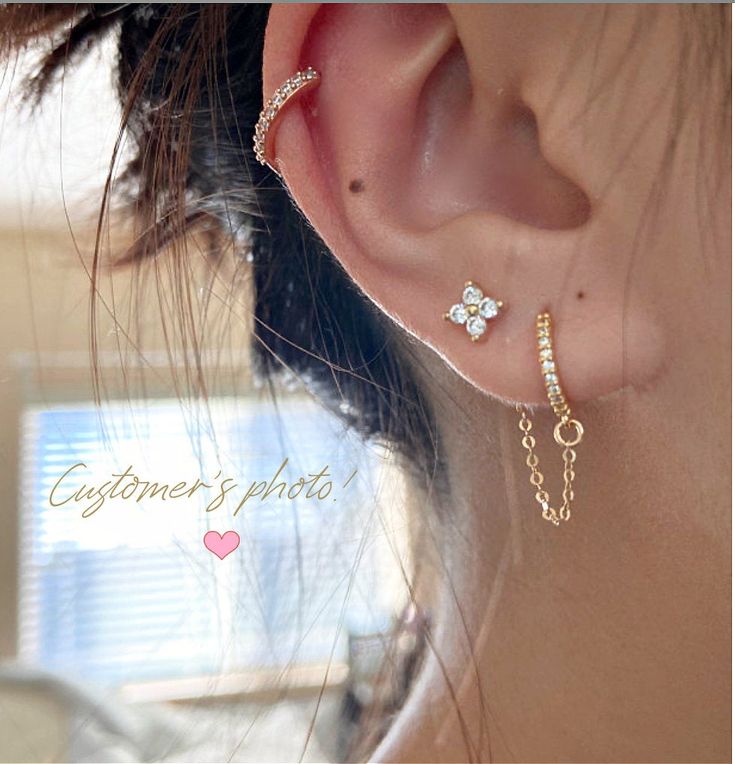 "Dainty set of two connected earring. A section of 14k gold filled chain connects the mini huggie hoop earring to the clutch of the flower stud. The ear cuff shown on the model is available separately in my shop (see link below). *You can only wear this earrings combo if you have TWO PIERCINGS IN ONE EAR! Please select the number of sets you need from the drop down menu: 1 set (for one ear) or - 2 sets (for two ears) *1 set includes one hoop and one cubic zirconia flower stud, connected with one Connected Earrings, 2 Ear Piercings, Top Ear Piercing, Double Ear Piercings, Gold Huggies, Cool Ear Piercings, Pretty Ear Piercings, Double Earrings, Preppy Jewelry