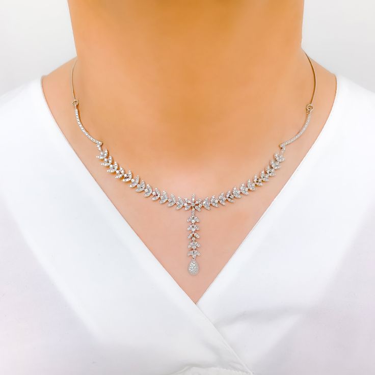 Radiant White Gold Diamond Necklace Set - the perfect addition to any sophisticated ensemble. Crafted from 18k white gold and weighing 24.1 grams, this piece features stunning round diamonds with a total weight of 2.96ct, set in a beautiful 17.5" necklace with a 1.25" drop length. It also comes with matching earrings with a length of 1.25" and screw backs for secure wearing. The lobster lock ensures this set stays safely in place, making it the perfect accessory for any occasion. PRODUCT DETAILS Silver Platinum Bridal Necklace With Single Cut Diamonds, Diamond White Platinum Bridal Necklace With Single Cut Diamonds, Silver Bridal Necklace With Single Cut Diamonds In Platinum, Silver Platinum Bridal Necklace With Diamond Cut, Dazzling Diamond White Platinum Necklace, Silver Platinum Bridal Necklace With Diamond Accents, Dazzling Platinum Necklace In Diamond White, Formal Diamond Necklace With Single Cut Diamonds, Luxury Round White Gold Drop Necklace