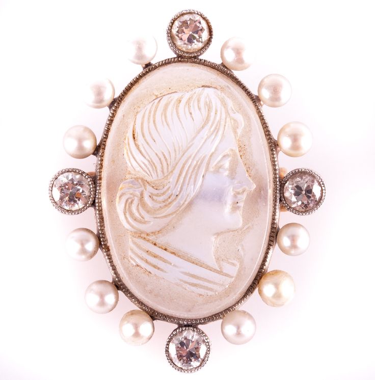 Vintage 1920's 14k Rose Gold Moonstone Diamond Pearl Brooch Pin .56ctw 4.5gMetal Information: 14k Rose GoldTotal Weight: 4.5gWidth: 22mmLength: 28.7mmCirca: 1920'sStone InformationMain StoneGem Type: MoonstoneShape: Cameo (20.5mm x 13mm)Color: Clear BlueClarity/Quality: ANumber of Stones: 1Accent StonesGem Type: DiamondShape: Old European (3.3mm)Color: HClarity/Quality: SI1Carat Weight: .14ctNumber of Stones: 4Accent StonesGem Type: PearlShape: Round (2.7mm)Color: Grey WhiteClarity/Quality: ANum Oval Brooch For Vintage Events, Victorian White Cabochon Brooches, White Victorian Cabochon Brooches, Vintage Gemstone Brooches, White Vintage Cabochon Brooches, Antique White Round Brooch, Antique White Round Brooches, Pearl Brooch, Moonstone