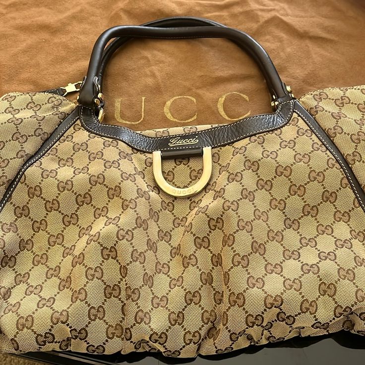 Please Note This Is A Pre-Owned Vintage Item That May Display Signs Of Wear Consistent With The Condition And Grade Listed Below. Gucci Shoulder Bag With Gold-tone Hardware For Shopping, Gucci Bags With Branded Hardware For Daily Use, Gucci Brown Satchel Bag, Gucci Tote Bag With Branded Hardware, Gucci Double Handle Bags With Gold-tone Hardware, Gucci Satchel With Handle Drop For Shopping, Gucci Shoulder Bag In Monogram Canvas With Gold-tone Hardware, Gucci Monogram Canvas Shoulder Bag With Gold-tone Hardware, Gucci Brown Satchel With Detachable Handle