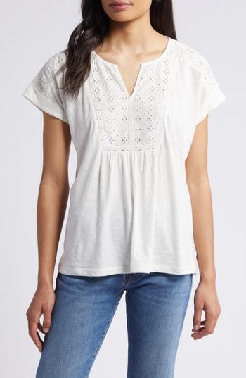 An airy openwork design tops this floaty top perfect for when the weather warms up. 24 1/2" length (size medium) Split neck Short sleeves 60% cotton, 40% modal with 100% cotton contrast Machine wash, tumble dry Imported White Relaxed Fit Breezy Tops, Relaxed Fit V-neck Pointelle Knit Top, Breezy Cotton Top For Day Out, Short Sleeve Open Knit Tops For Vacation, Feminine Cotton Knit Top For Spring, Breezy Spring Tops For Day Out, Summer Vacation Pointelle Knit Tops, White Breezy Top For Day Out, Feminine Open Knit Tops For Spring