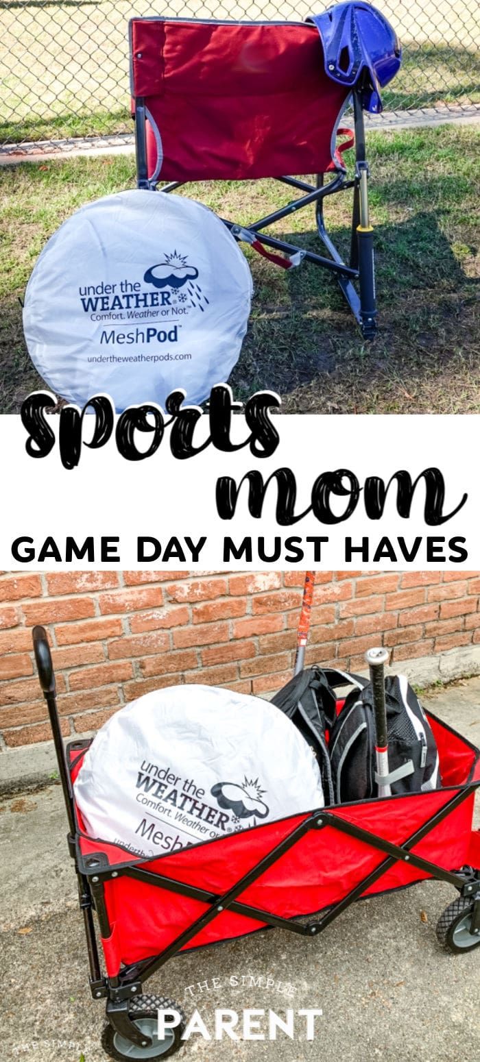 a red wagon filled with sports gear next to a fence