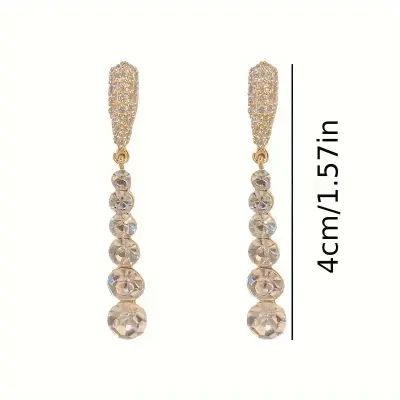 Crystal diamond formal-styled bridal drop earrings. To avoid tarnish, limit exposure to water, perfume, or body cream.

2-day processing. Shipped in 4-7 days. Party Drop Linear Earrings, Evening Pearl Drop Diamond Earrings, Formal Teardrop Chandelier Earrings With Diamond Accents, Formal Diamond White Chandelier Earrings For Pierced Ears, Teardrop Chandelier Earrings With Diamond Accents For Formal Occasions, Glamorous Formal Bridal Earrings With Sparkling Stones, Elegant Crystal Bridal Earrings For Glamorous Events, Elegant Bridal Earrings In Diamond White For Formal Occasions, Elegant Diamond White Bridal Earrings For Formal Events