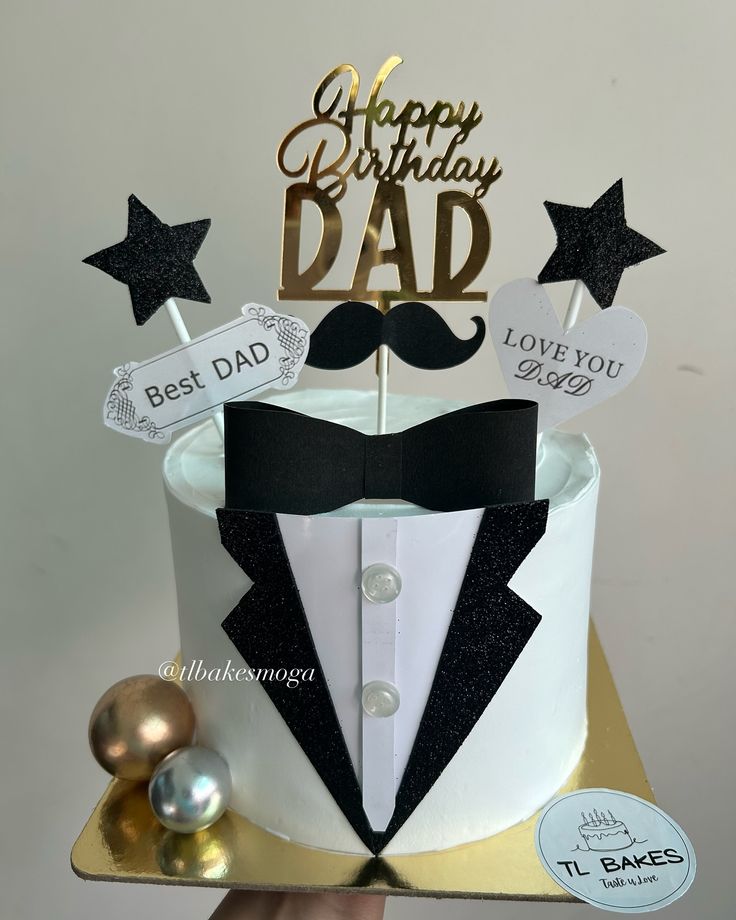 a birthday cake with a mustache, bow tie and nametags that says happy birthday dad