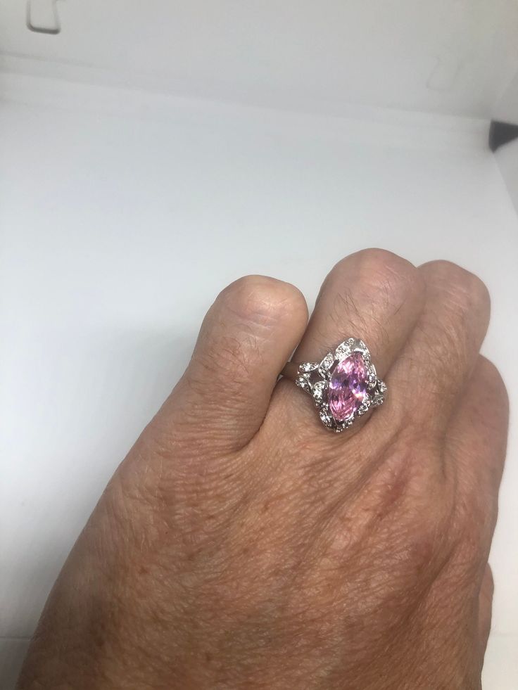 Vintage white and pink CZ ring 925 Sterling Silver Setting Size 7 Can be resized, my jeweler charges $10-$20 All rings are shipped free in the US in a nice gift box. Check out our over a THOUSAND great reviews Engraving is $4 per letter and is not always perfect depending on the piece. It can take a few days if the jeweler is busy. This is payable to Paypal Judithsltd@gmail.com Formal Pink Sterling Silver Diamond Ring, Pink Sterling Silver Crystal Ring With Center Stone, Pink Sterling Silver Crystal Ring With Gem, Pink Sterling Silver Crystal Ring For Formal Occasions, Pink Sterling Silver Crystal Open Ring, Pink Sterling Silver Diamond Ring With Accent Stones, Pink Diamond Open Ring Jewelry, Pink Sterling Silver Diamond Ring With Vs Clarity, Pink Sterling Silver Rings With Accent Stones