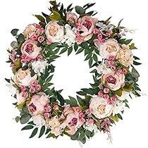 a floral wreath with pink and white flowers