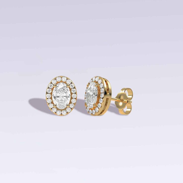 Crafted to perfection, these Ellipse Halo Studs are a true embodiment of sophistication and grace featuring an ellipse-cut diamond at the center. To amplify its allure, a delicate halo of round diamonds encircles the elliptical beauty. Whether you're attending a glamorous soirée, a romantic dinner, or a professional meeting, these diamond stud earrings will enhance your charm and sophistication. Luxury Diamond Earrings With Baguette Cut Halo Design, Timeless Diamond Earrings For Wedding, Timeless Diamond Wedding Earrings, Timeless Formal Jewelry With Lab Grown Diamonds, Luxury Marquise Diamond Earrings For Formal Occasions, Brilliant Cut Marquise Diamond Earrings For Formal Occasions, Elegant Marquise Diamond Earrings For Formal Occasions, Timeless Yellow Gold Diamond Earrings For Formal Occasions, Luxury Marquise Cut Diamond Earrings