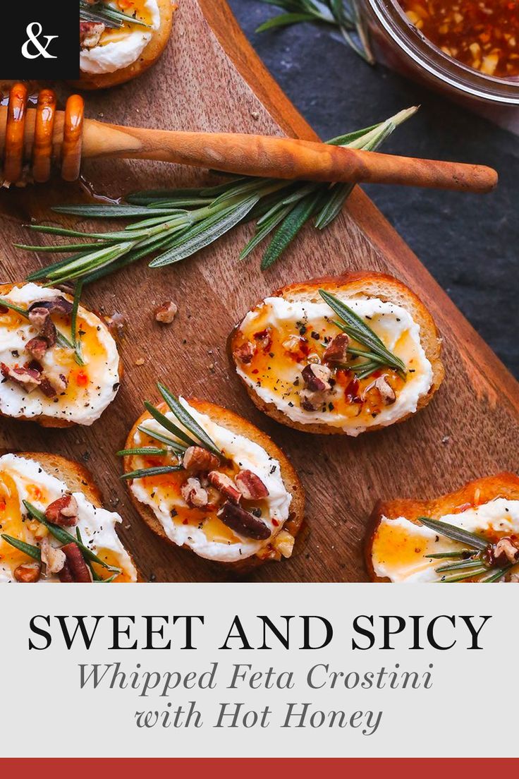 sweet and spicy whipped feta crostini with hot honey on a cutting board