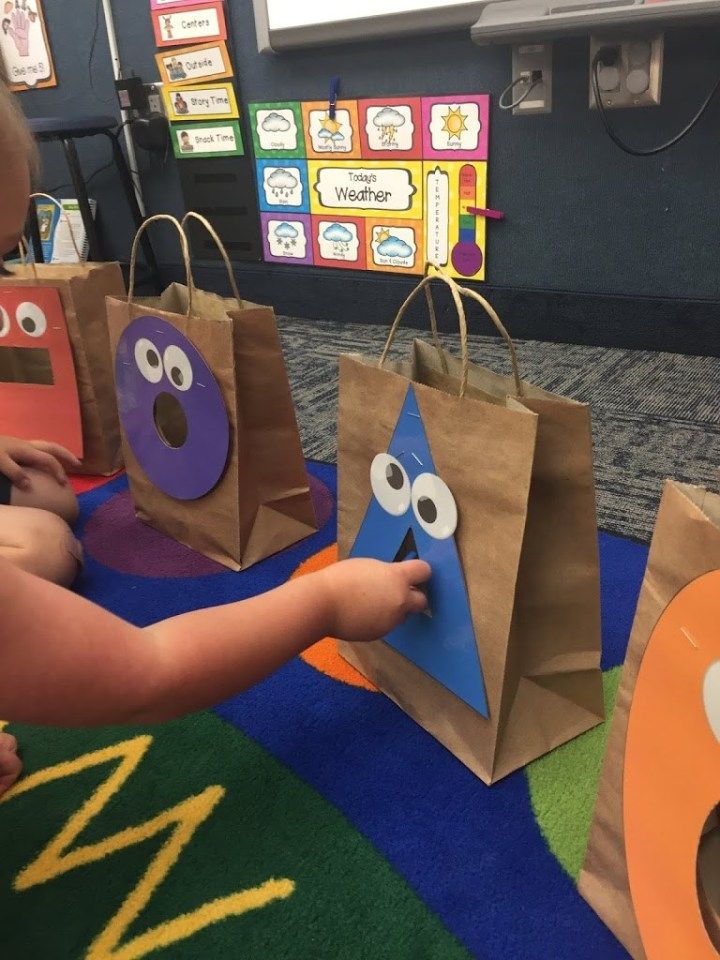 some paper bags that have faces on them