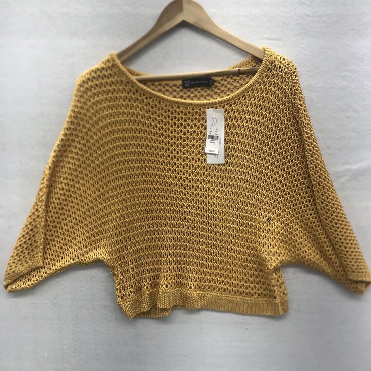 New York & Company Womens Knit Top Size Small Gold Crop Batwing Sleeves. New With Tags See All Photos For Detail And Measurements All Measurements Taken Laying Flat Spring Yellow Soft Knit Tops, Spring Knit Tops With Batwing Sleeve, Summer Knit Batwing Sleeve Tops, Spring Textured Knit Top With Batwing Sleeves, Knit Batwing Sleeve Tops For Summer, Summer Knit Tops With Batwing Sleeve, Casual One Size Knitted Tops, Spring Batwing Sleeve Knit Top, One Size Casual Knitted Tops